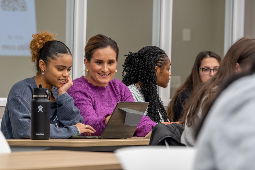 class-231110a1388 Associate Professor Diana Sobieraj talking with students in the classroom at the School of Pharmacy